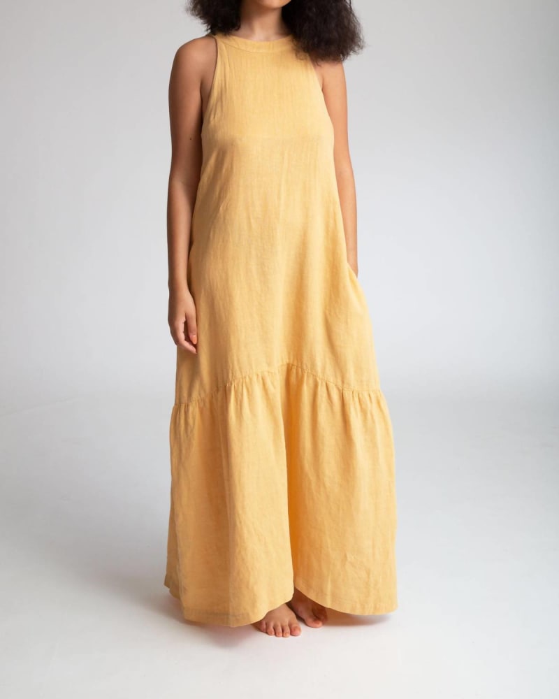 Front of a model wearing a size L Praya Linen Dress in Sunflower in Sunflower by Beaumont Organic. | dia_product_style_image_id:335156